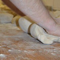Verarbeitung der Teiglinge bei Grafe Beck - Bäckerei Graf